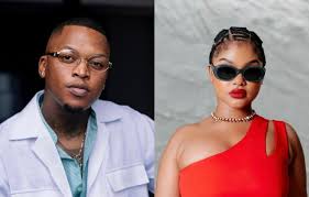 "Oscar Mbo and Mawhoo performing together on stage at Durban July, creating an electrifying atmosphere with their fusion of Afro House and soulful beats."