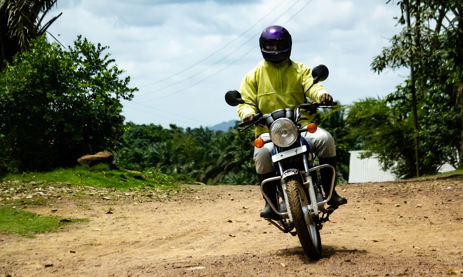 rwanda motorbike adventure in lush jungle trails